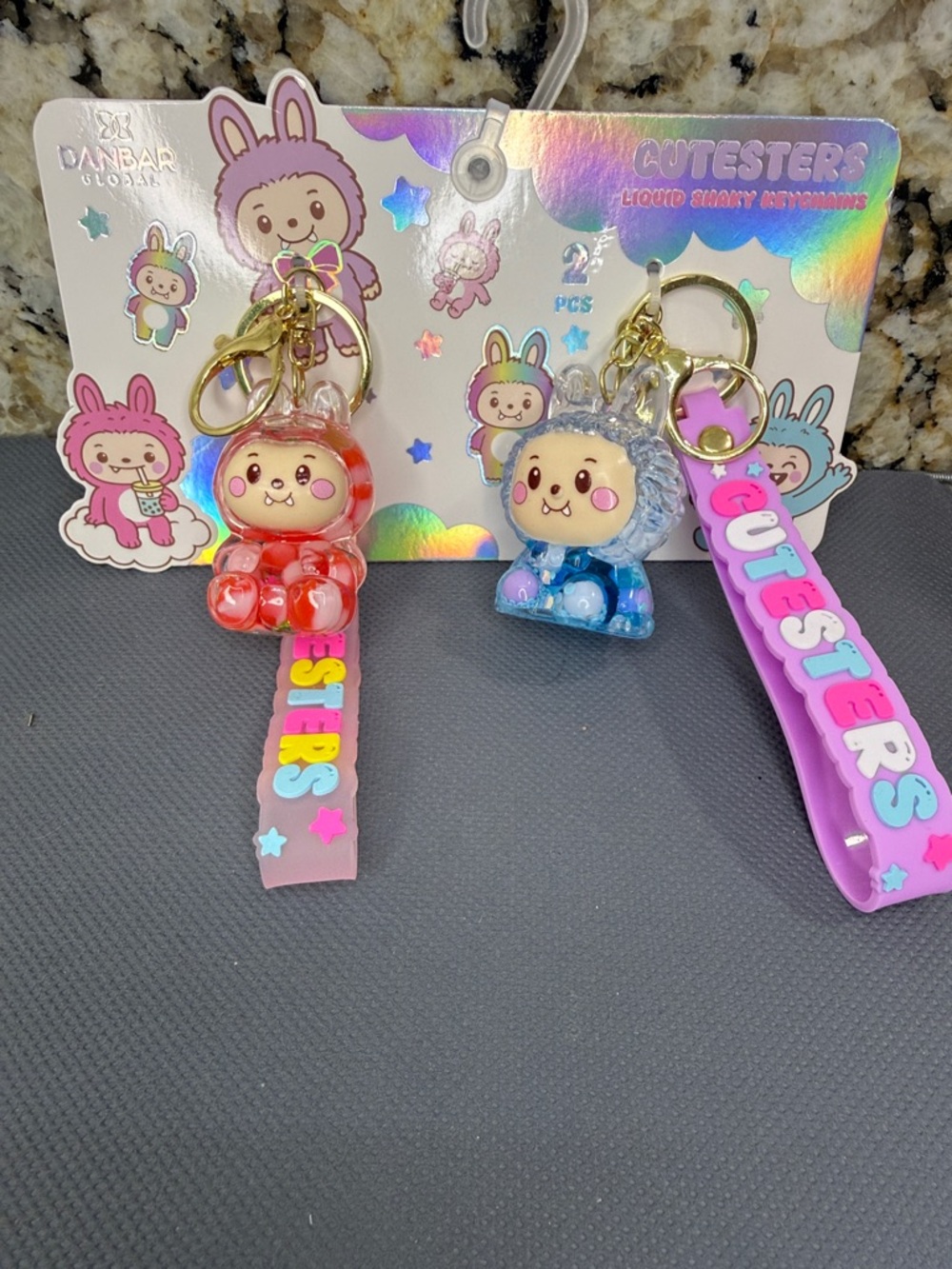 NWT Cutesters 2pc keychain set Liquid Charm Keychain - Red & Blue